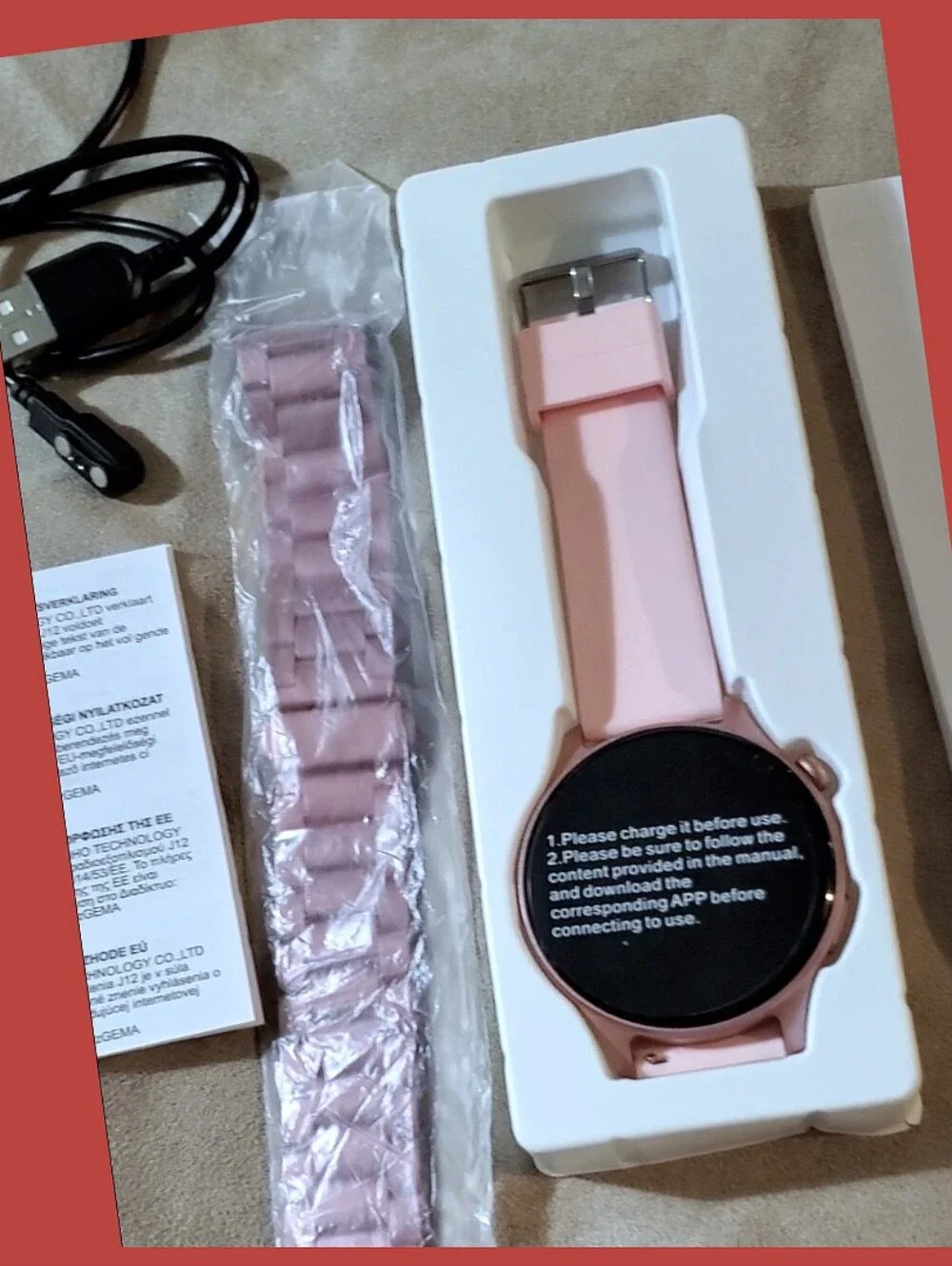 Pink Smartwatch with extra Band and Accessories